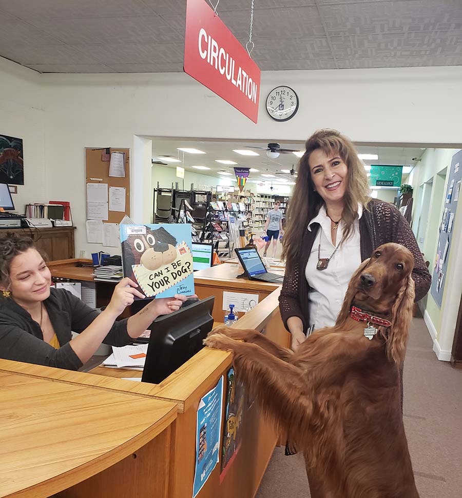 Bing the dog at library circulation desk